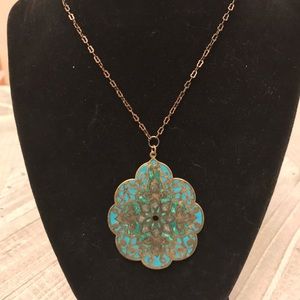 Necklace with metal pendant